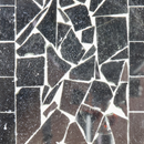 Close-up of the Modern Mosaic Fly-Through Bird Feeder in mirrored diamond, showing irregular reflective mirrored glass pieces arranged in a mosaic pattern.