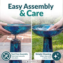 Crackled Glass Mosaic Bird Bath in deep ocean swirl shown being assembled and cleaned outdoors. The bowl twists securely onto the pedestal without tools, and the glass surface can be wiped clean with a damp cloth.