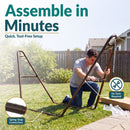 Bronze metal hammock stand shown being assembled outdoors. Tool-free setup features spring-snap connections for quick and easy assembly.