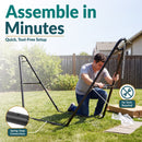 Black metal hammock stand shown being assembled outdoors. Tool-free setup features spring-snap connections for quick and easy assembly.