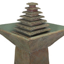 Close-up view of the tiered pyramid water feature and square basin of an outdoor pedestal fountain.