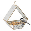 Modern Mosaic Fly-Through Bird Feeder in mirrored diamond filled with birdseed, with a small black, white, and gray songbird perched on the edge of the open feeder.