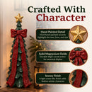 Infographic featuring a green Christmas tree sculpture with a red bow and gold star, highlighting hand-painted detail, solid magnesium oxide construction, and a snowy finish.