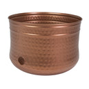 Hammered Iron Hose Pot in copper, featuring a rounded metal design with a textured hammered finish, rolled rim, and side opening for convenient hose access.