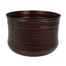 Rear view of the bronze Hammered Iron Hose Pot, featuring a rounded metal design with a textured hammered finish and rolled upper rim.