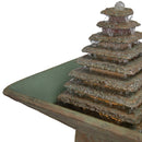 Close-up view of the tiered pyramid water feature with water cascading into the square basin of an outdoor pedestal fountain.