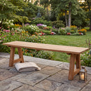 Sunnydaze Teak Trestle Bench in a midwestern backyard