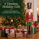 Red and green Kristoff Christmas Nutcracker shown beside a decorated Christmas tree and wrapped gifts, highlighting a festive holiday gift designed to be enjoyed season after season.