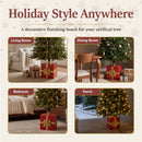 Pretty Present Decorative Christmas Tree Base shown with artificial Christmas trees in a living room, dining room, bedroom, and covered porch, highlighting its decorative gift box design for a variety of seasonal spaces.