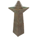 Outdoor pedestal fountain with a tiered pyramid water feature and wide square basin.