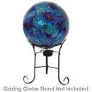 Deep ocean blue gazing globe with mosaic crackled glass pattern sitting in a black metal gazing globe stand.