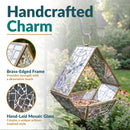 Modern Mosaic Fly-Through Bird Feeder in mirrored diamond shown hanging in a garden, featuring a brass-edged frame and hand-laid mirrored mosaic glass for a decorative artisan-style design.