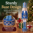 Blue Kristoff Christmas Nutcracker shown beside a decorated Christmas tree and wrapped gifts, featuring a sturdy decorative base designed for stable placement on flat surfaces.