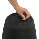 Anjelica Planter - 15.25 in (38 cm) - Matte Black, on a white background with a model putting the plug in for the fillable double wall section