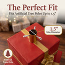 Present Pile Decorative Christmas Tree Base shown from above, featuring a built-in holder with three securing bolts designed to fit artificial tree poles up to 1.5 inches in diameter.